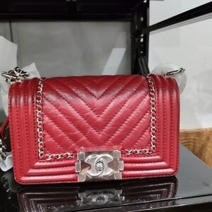 CHANEL Red Quilted Leather Boy Crossbody with Silver Chain